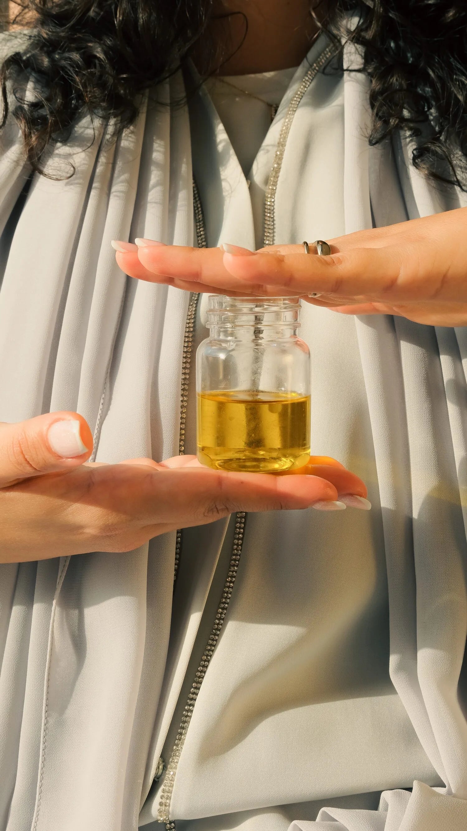 Olive oil poured into an open palm